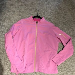 Nike jacket with a gold zipper on the sleeve